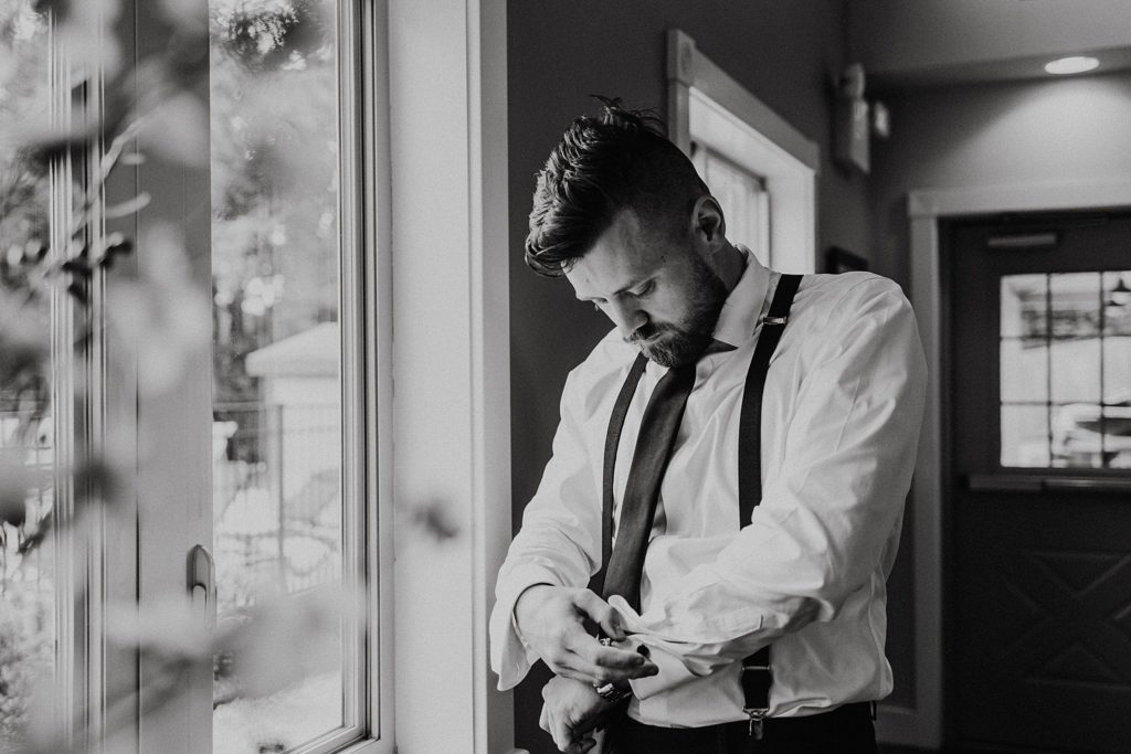 Black and white portraits of West Chester groom getting ready