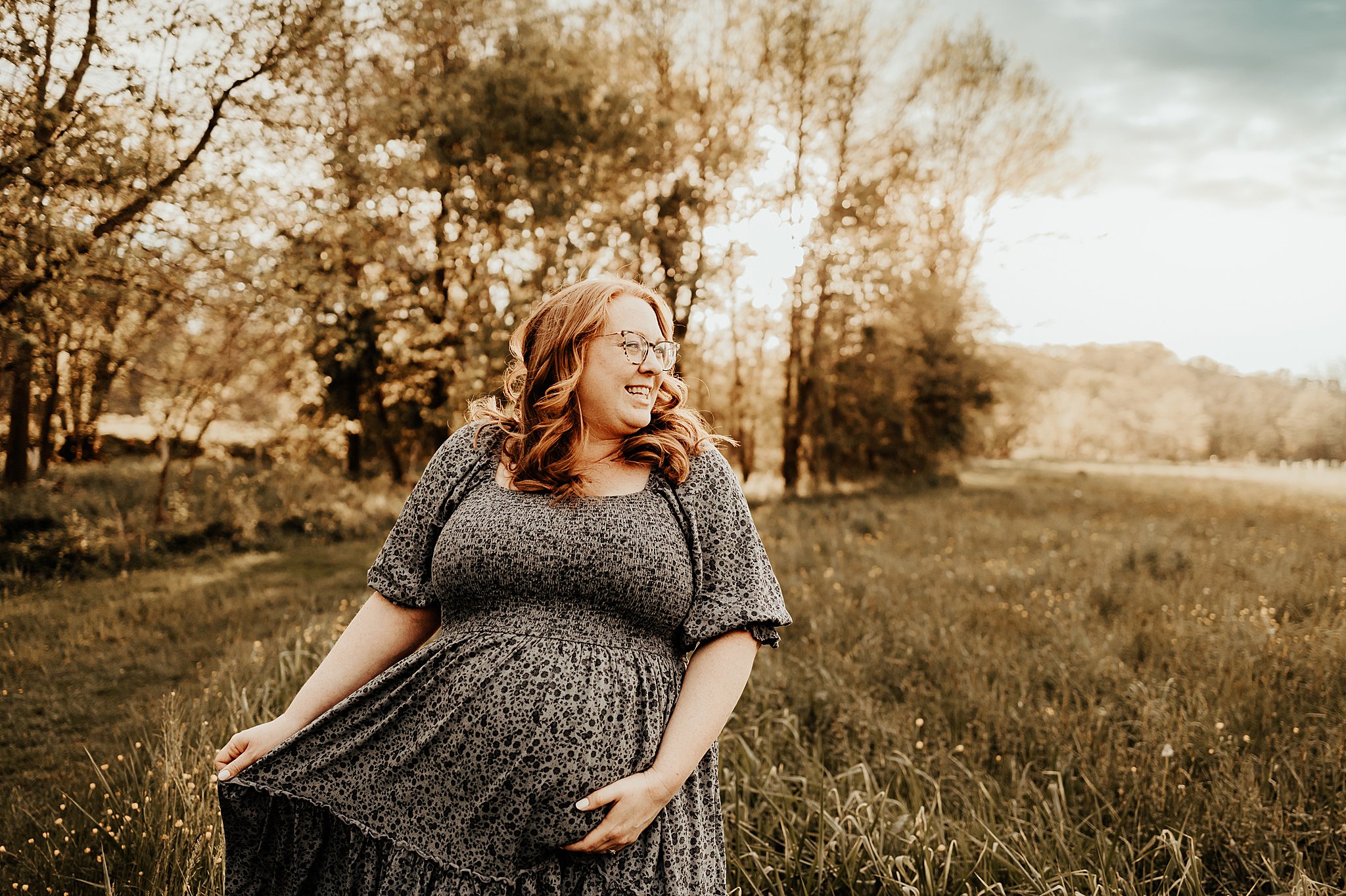 maternity photography by Brey Photo taken in West Chester Stroud Preserve at sunset in a field with a blue sky