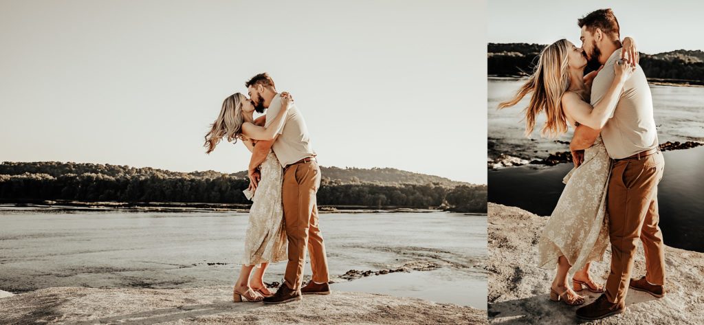 Engaged couple overlooking the Susquehanna River from atop the White Cliffs of Canoy during a golden hour sunset in a green dress and brown pants