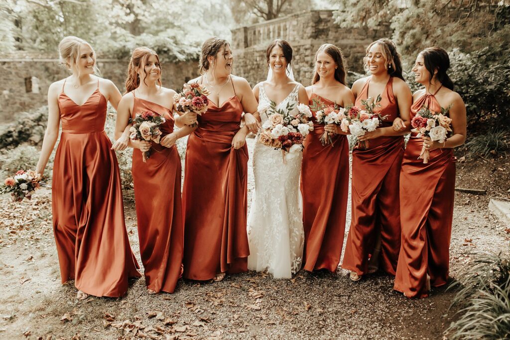 Bridal party pre-wedding photos holding hand-dyed floral bouquets outdoors at the Parque at Ridley Creek State Park in Media PA